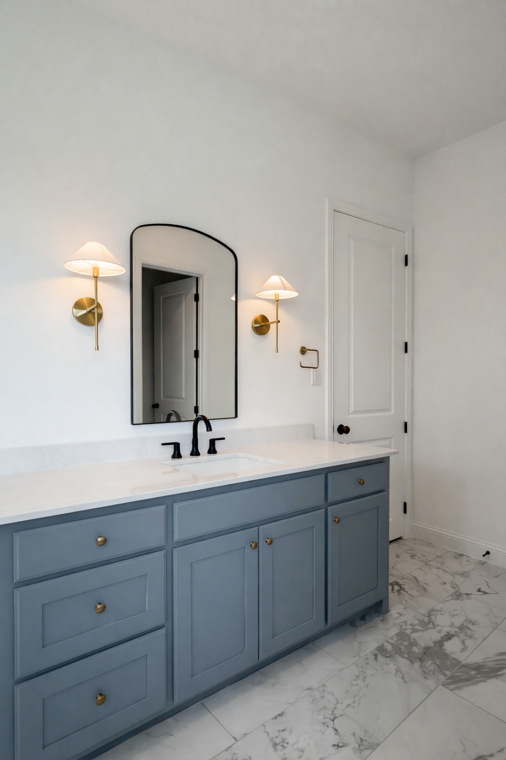 Primary bathroom with single vanity and elegant fixtures