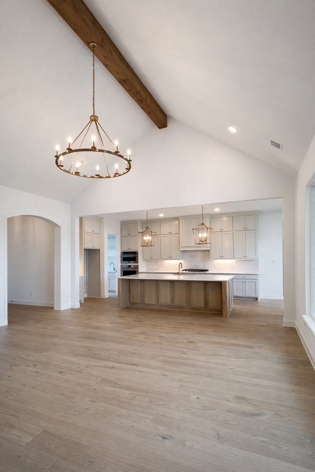 Open kitchen and living area with vaulted ceiling